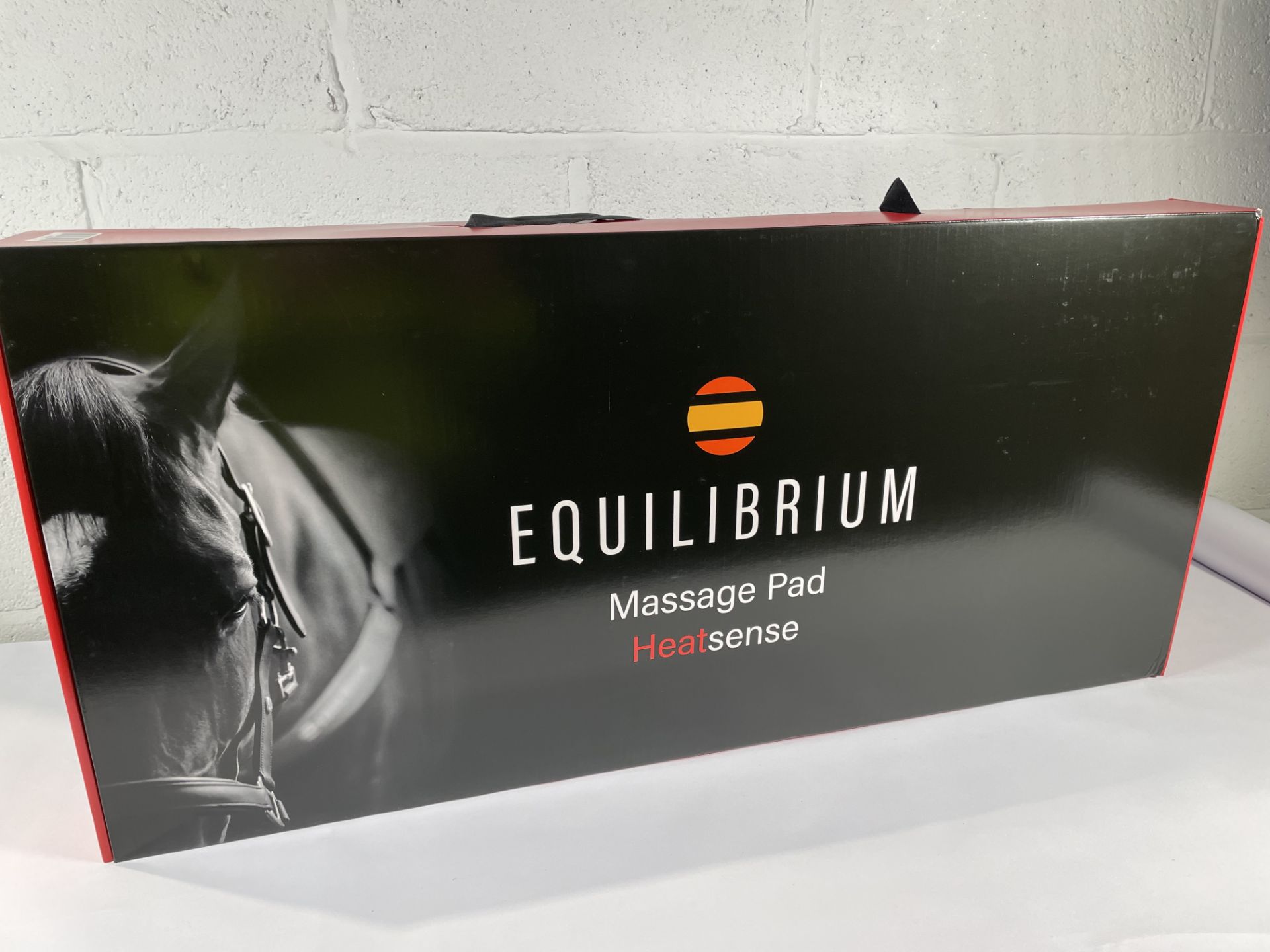 A boxed as new Equilibrium Heatsense Massage back pad, standard (90cm).
