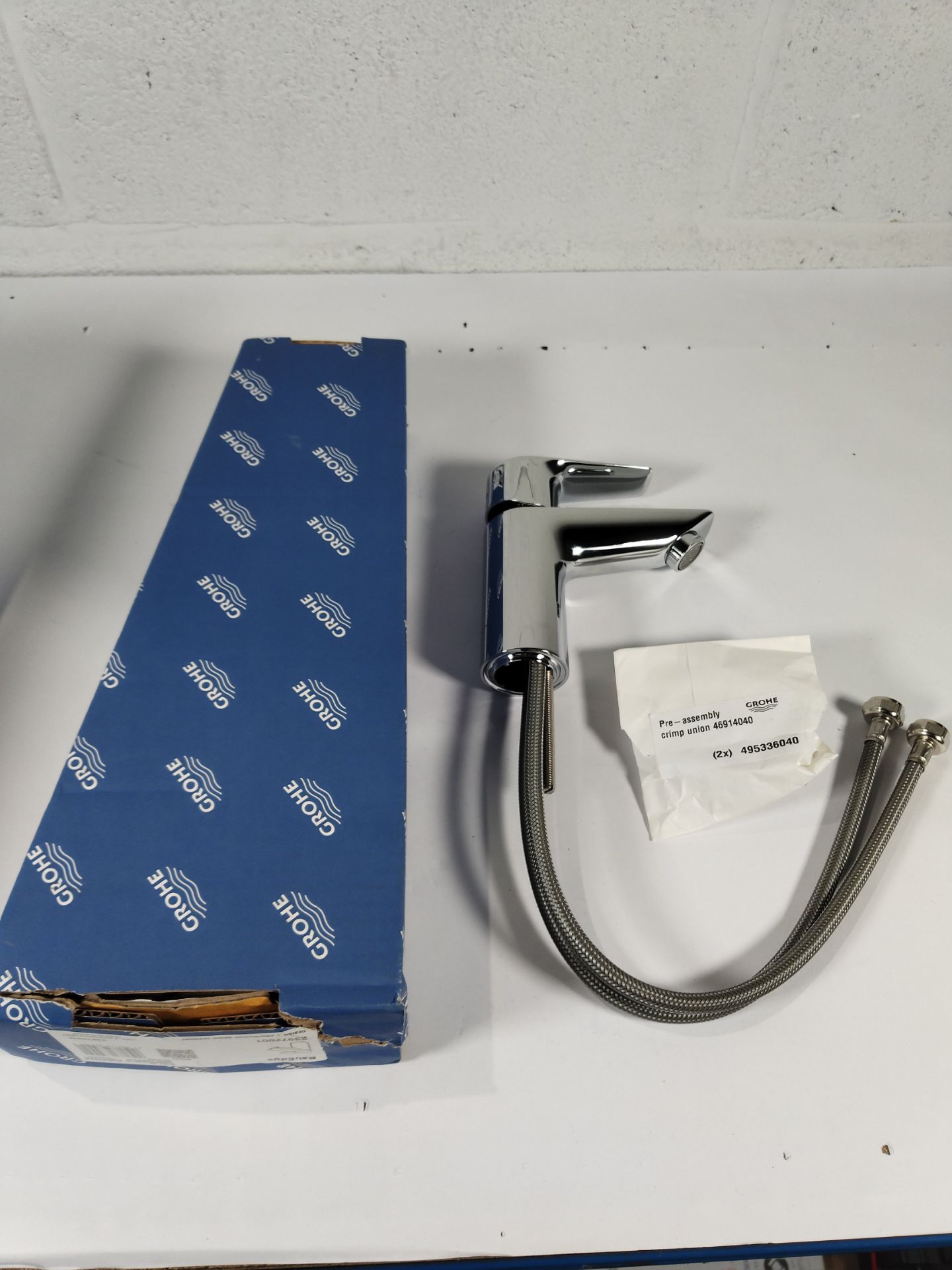 Three boxed as new Grohe BauEdge mono basin mixer taps in chrome.