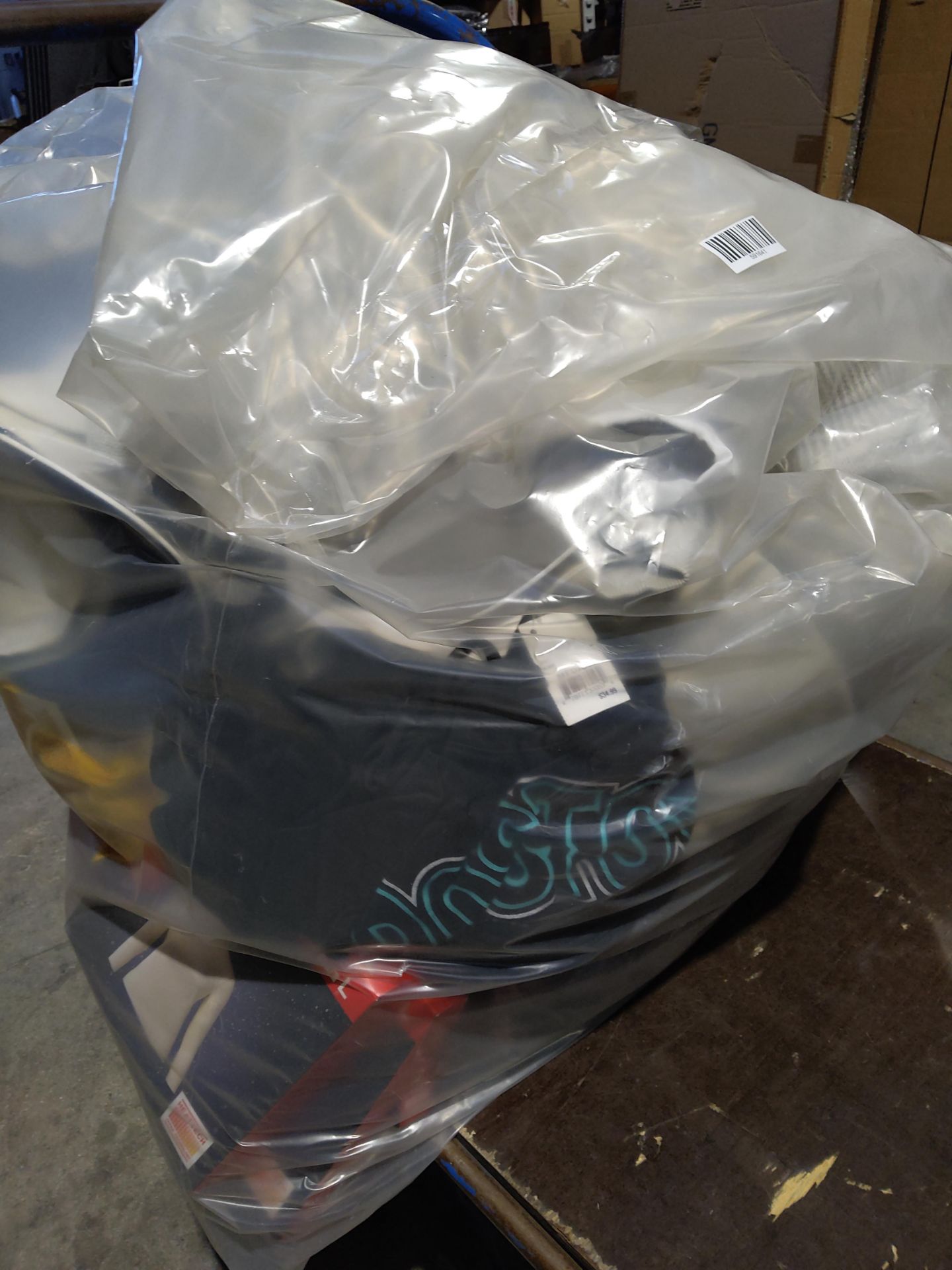 A large bag of assorted as new clothing with tags to include Reiss, John Lewis and related.