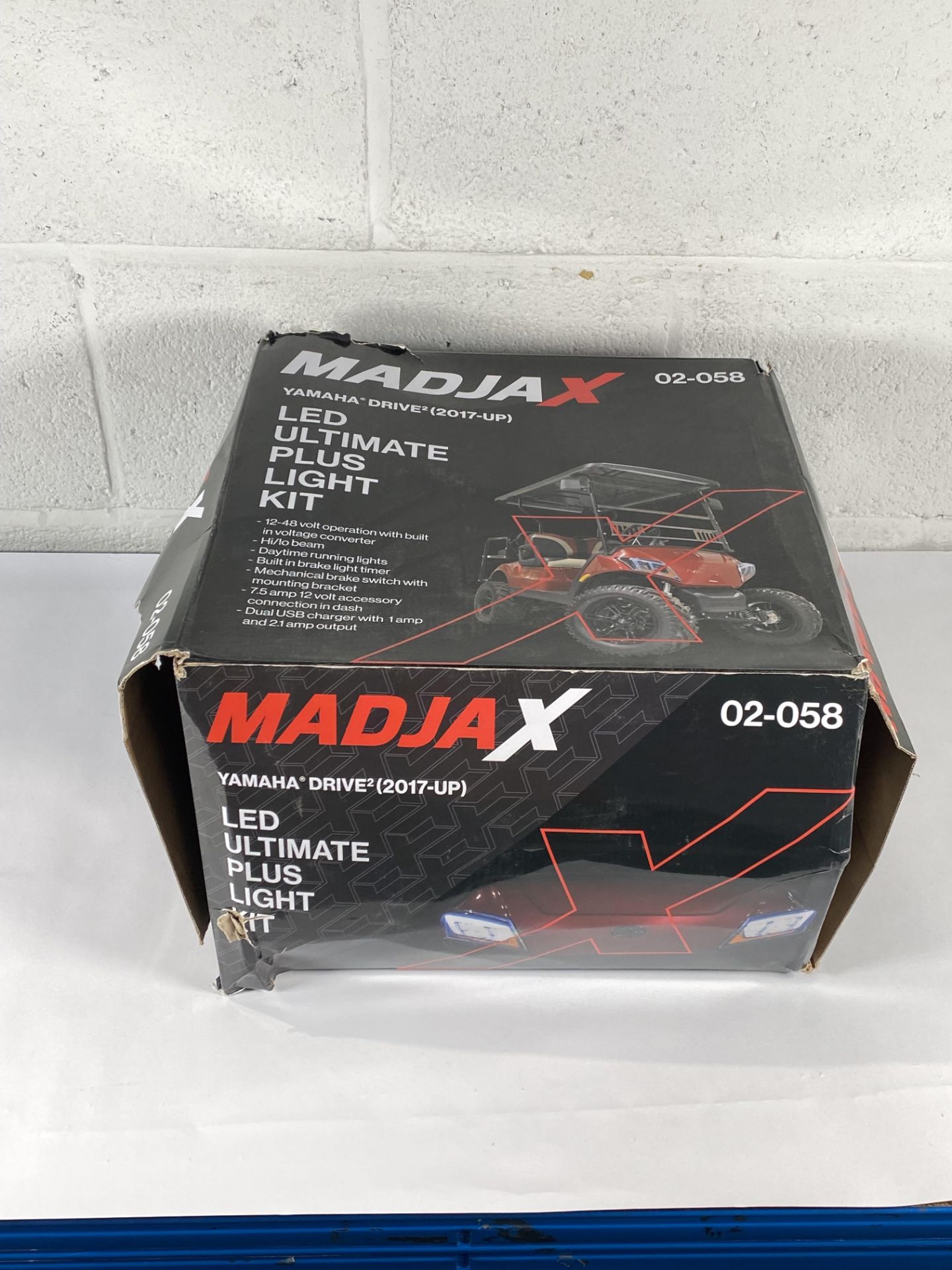 A MadJax Yamaha Drive 2 golf cart LED Ultimate Plus light kit (damage to box).