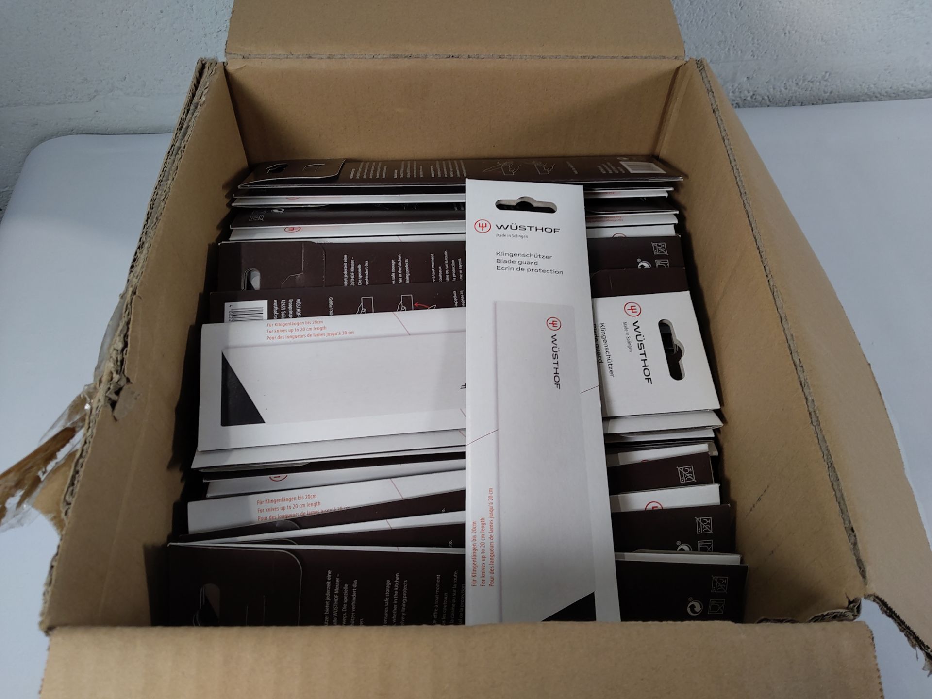 Approximately one hundred as new Wusthof blade guards for knives up to 20cm long (4002293110776).