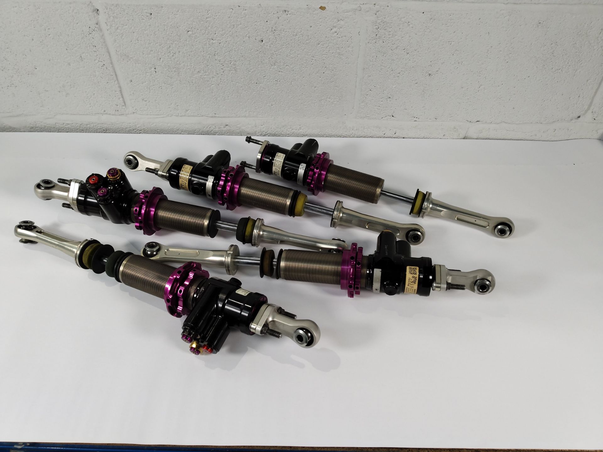 Five pre-owned KW racing coilovers: 38AD0-123A FA LE, 38AD0-124A FA RA, 38AE0-123A RA LE, 38AE0-124A