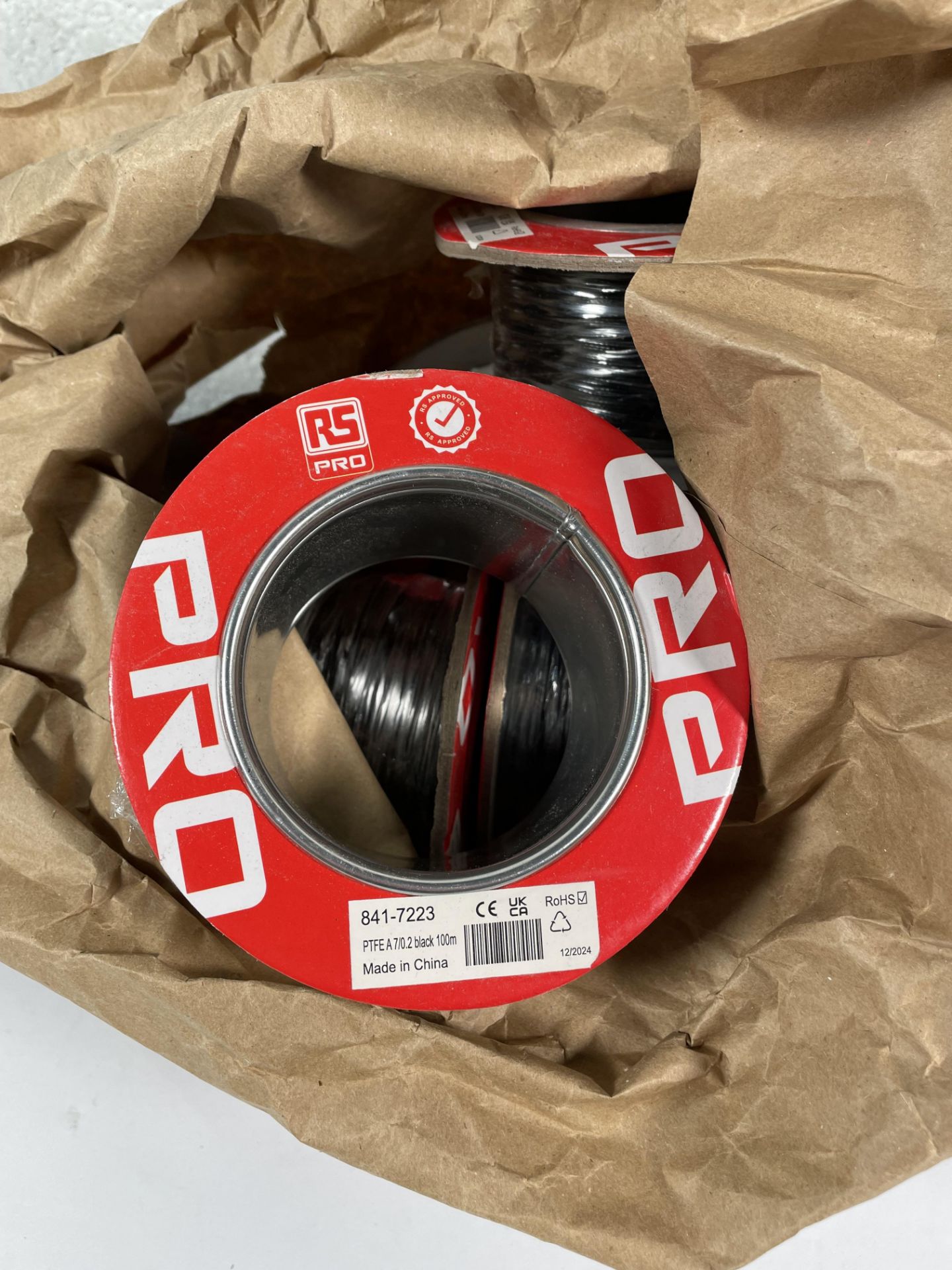 Ten RS PRO Black 0.22mm² Hook Up Wire, 24 AWG, 7/0.2 mm, 100m, PTFE Insulation (841-7223).