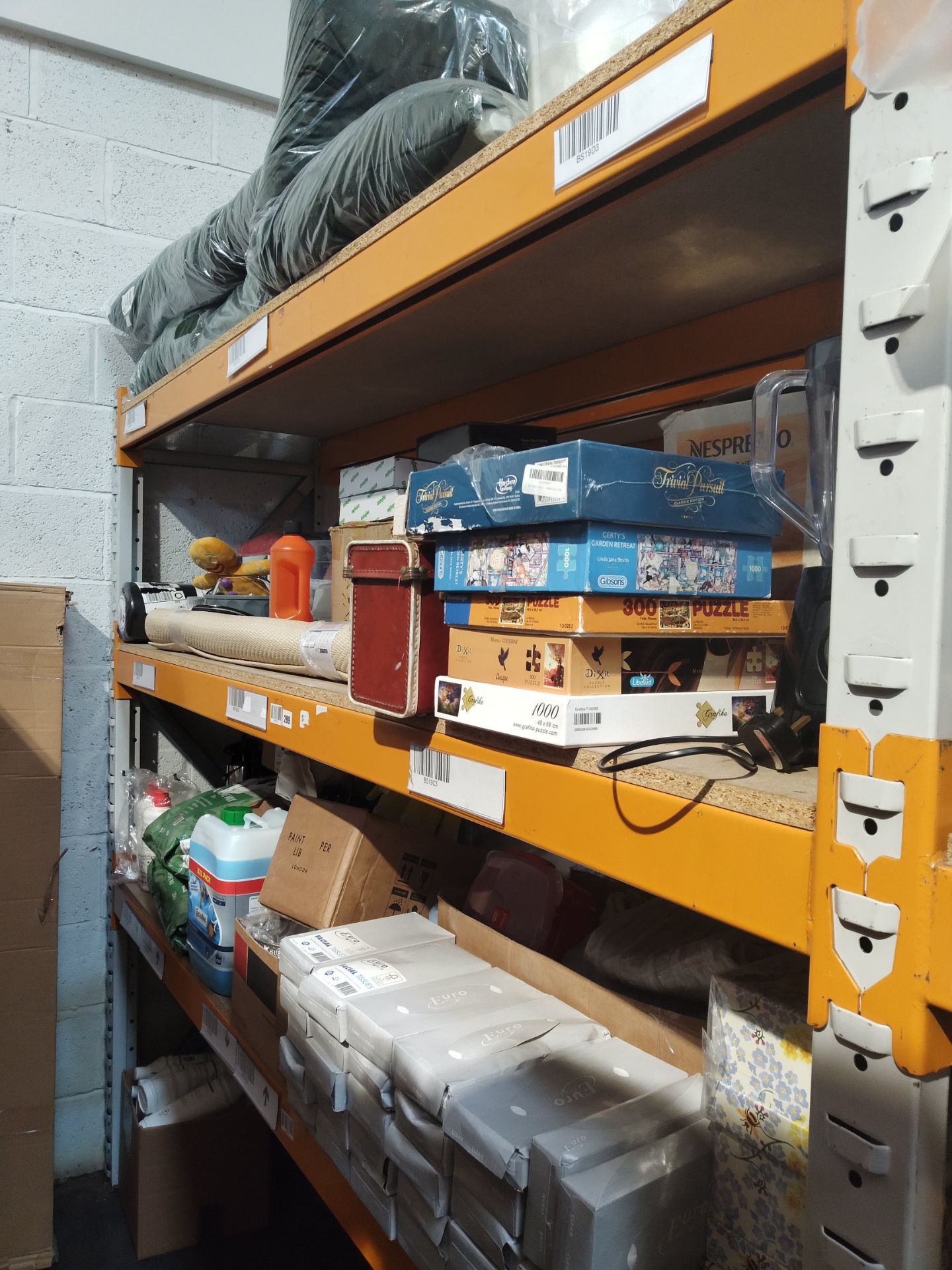 A large quantity of assorted homeware and related items on two shelves.