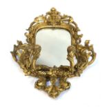 A 19th century shaped gilt gesso girandole mirror with two sconces, 76cm high