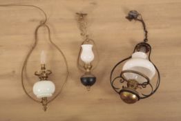 Three 19th century and later oil lamps pendant lights later converted for electricity, two with
