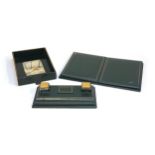 A green and gilt tooled leather desk blotter 48cmW; together with a matching ink stand with brass