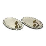 A pair of early 20th century oval girandole mirrors, with bobble engraved bevelled glass and