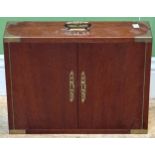 A hardwood and brass bound decanter and tumbler holder