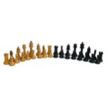 A complete set of early 20th century carved wooden chess pieces, unweighted, the king 9cmH