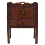 A George III tray top commode, the galleried top with cutout handles, over two doors and a converted