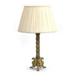 A 19th century French gilt brass table lamp with spiral stem supported on triform griffin base, 42cm