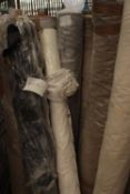 12 x rolls of upholstery fabric, mainly browns and greys, including 1 x Trunda 35.3m x 142cm, 1 x