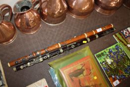 A wooden flute by Potter of London and another