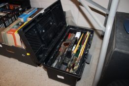 A collection of various artists brushes and paints