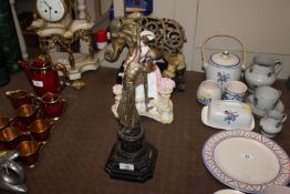 In the manner of Chiparus, bronze figure of a dancer on stepped marble plinth