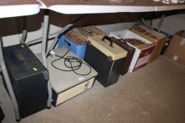 A collection of various records, the majority Bing Crosby and a retro Solid State record player -