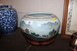 An Oriental porcelain jardinière with scenic decor