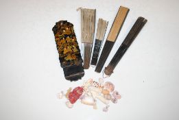 An Oriental black lacquered figural decorated fold