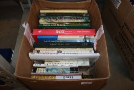 A box containing various antique reference and gar