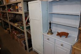 A painted single door wardrobe