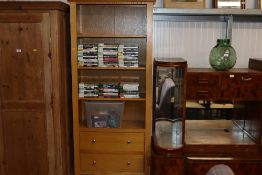 A modern oak book case fitted two drawers measuring approx. 81cms wide x 32cms deep x 181cms high