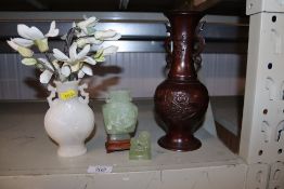 A jade coloured Chinese vase and cover with Kylin finial; a Chinese bronze baluster vase and a white