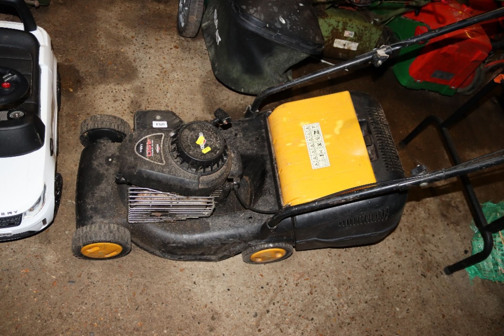 A petrol rotary lawn mower with Briggs and Stratto