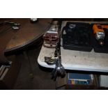 A quantity of golf clubs and a shooting stick