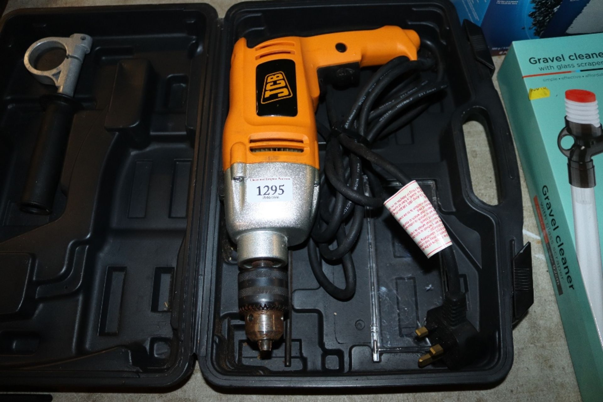 A JCB JCBD-HD1010F 240V hammer drill in fitted pla