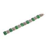 A jade and diamond set bracelet, the white metal mounts unmarked, 22.2gms total weight