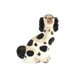 A pair of Victorian Staffordshire spaniel ornaments, 33cm high