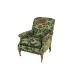 A late 19th / early 20th Century deep seated easy chair by Howard & Sons, raised on turned front