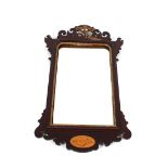 A mahogany fret carved wall mirror, in the Chippendale manner with conch shell inlay and gilt ho
