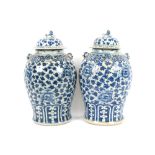 A pair of 19th Century Chinese baluster vases and covers, surmounted by Kylin finials above raised