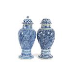 A near pair of 19th Century Chinese blue and white baluster vases, of whorled fluted design on