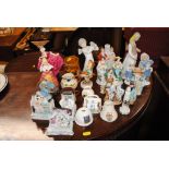 A collection of various porcelain figure groups to include Farings, Doulton figurine, Motto ware,