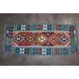 An approx. 138cms x 58cms Chobi Kilim runner