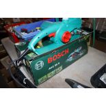 An as new Bosch AKE 35S electric chainsaw