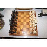 A figural chess set and board