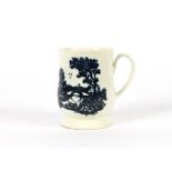 A Liverpool baluster mug, having raised blue and white scenic decoration to the body, 10cm high