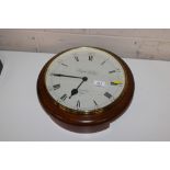 A Knight & Gibbins battery operated wall clock
