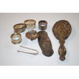 A silver dressing table hand mirror mount; a silver brush mount; a silver salt in the form of a