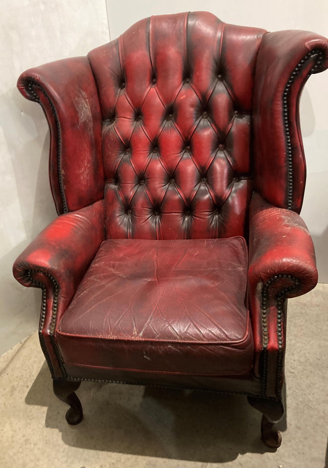 An oxblood red leather button back high wingback armchair (CWH Ref: MA7)