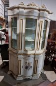 Indian style display cabinet, the upper shelved section having three glazed doors,