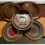 Five early 20th century oak items including perpetual calendar and four coin trays (CWH Ref: MA7)