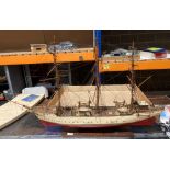 A large detailed model ship 'Danmark' on a wooden stand,