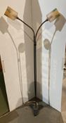 A vintage metal standard lamp, the two lights on adjustable supports,