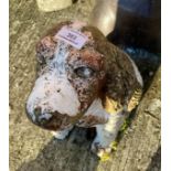 Painted concrete sculpture of a spaniel,