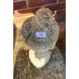 Concrete sculpture of a bird of prey,